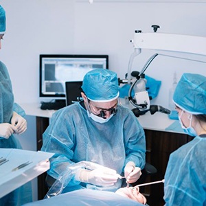 Team performing dental implant surgery
