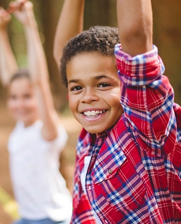 kid raising hands