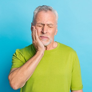 Older man struggling with mouth pain