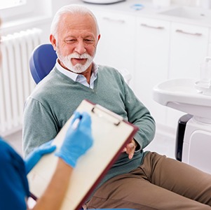 Senior man attending dental consultation