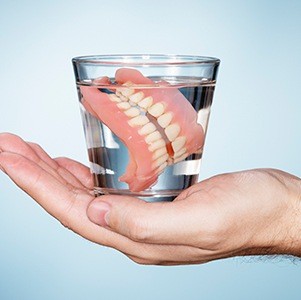 dentures in glass of water