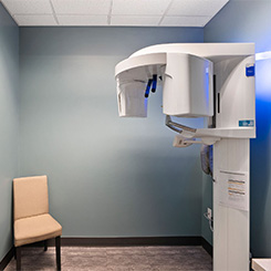 dental team in exam room working on patient