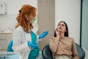 Concerned patient talking with her dentist 
