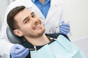 Happy patient attending his first dental checkup of 2022