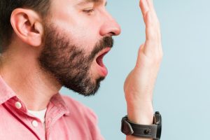 Man with bad breath, a sign of dehydration in Colorado Springs