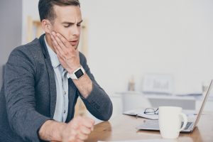 Man without dental insurance, in need of emergency treatment