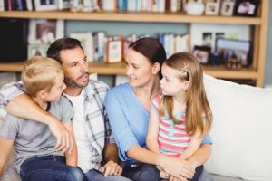 Parents and children discussing, “Can bad teeth run in the family?”