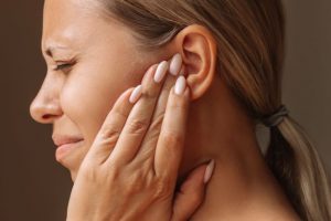 Side view of woman with facial pain