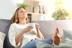 Woman relaxing at home after her root canal therapy