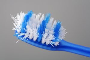 close-up of blue and white frayed toothbrush head