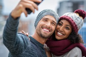 smiling couple dressed in winter clothes